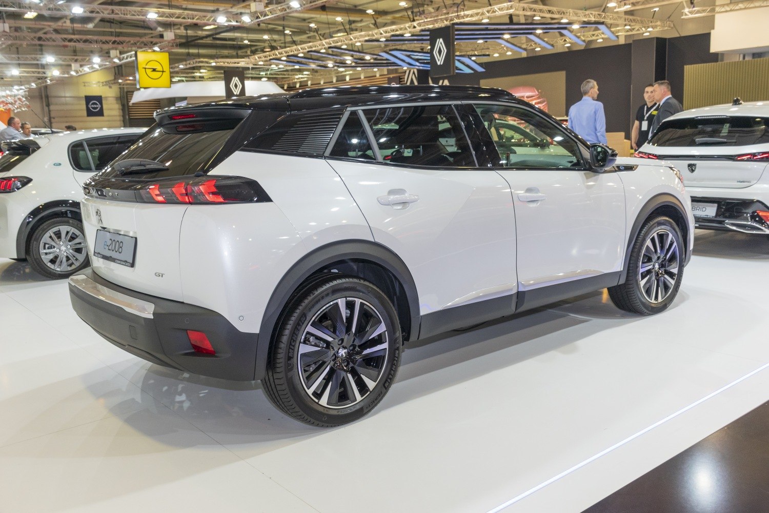 White compact SUV rear-side view with black roof and alloy wheels
