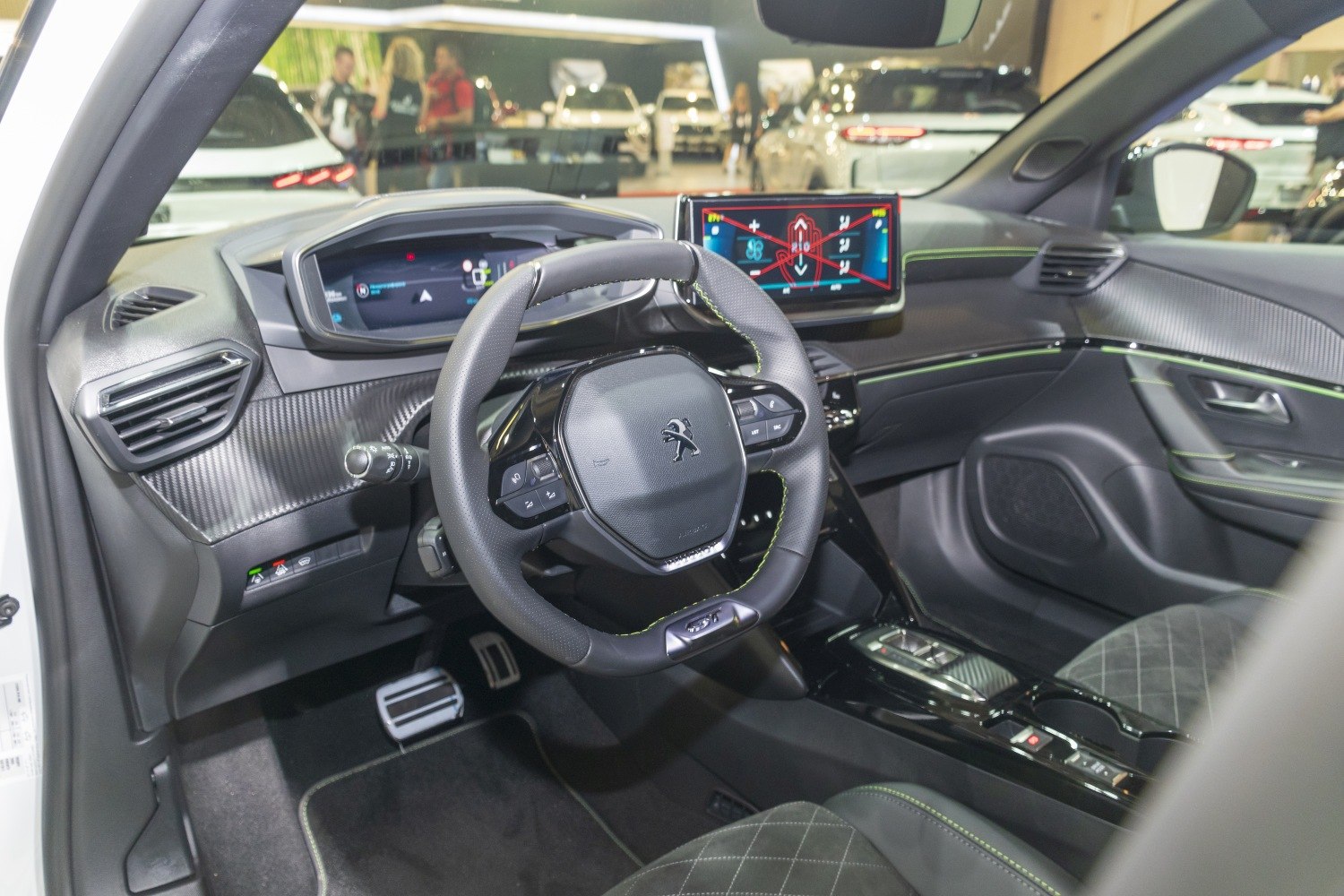 Dashboard and steering wheel with digital displays, interior trim details