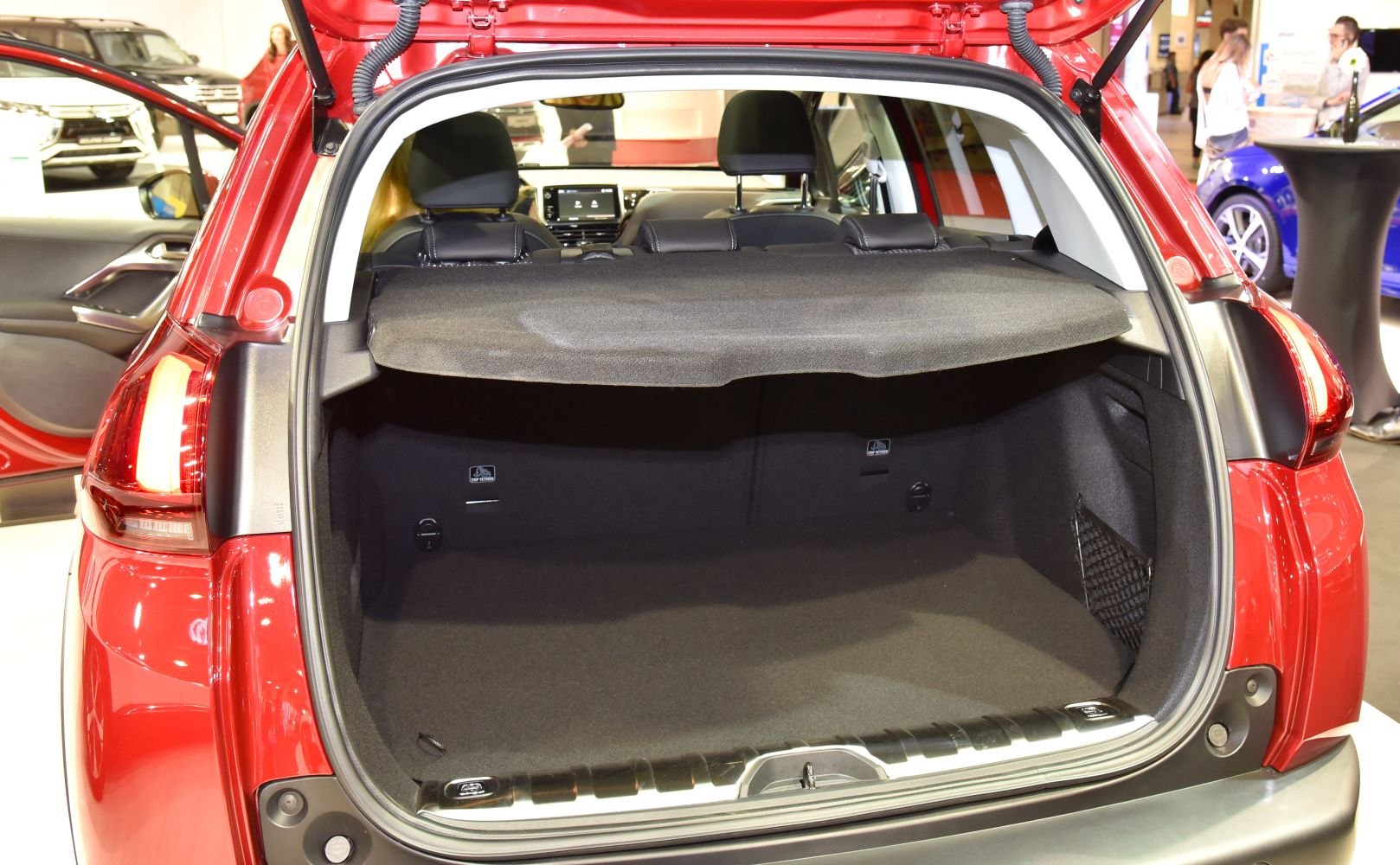 Open trunk cargo area with rear seats visible and trunk cover.