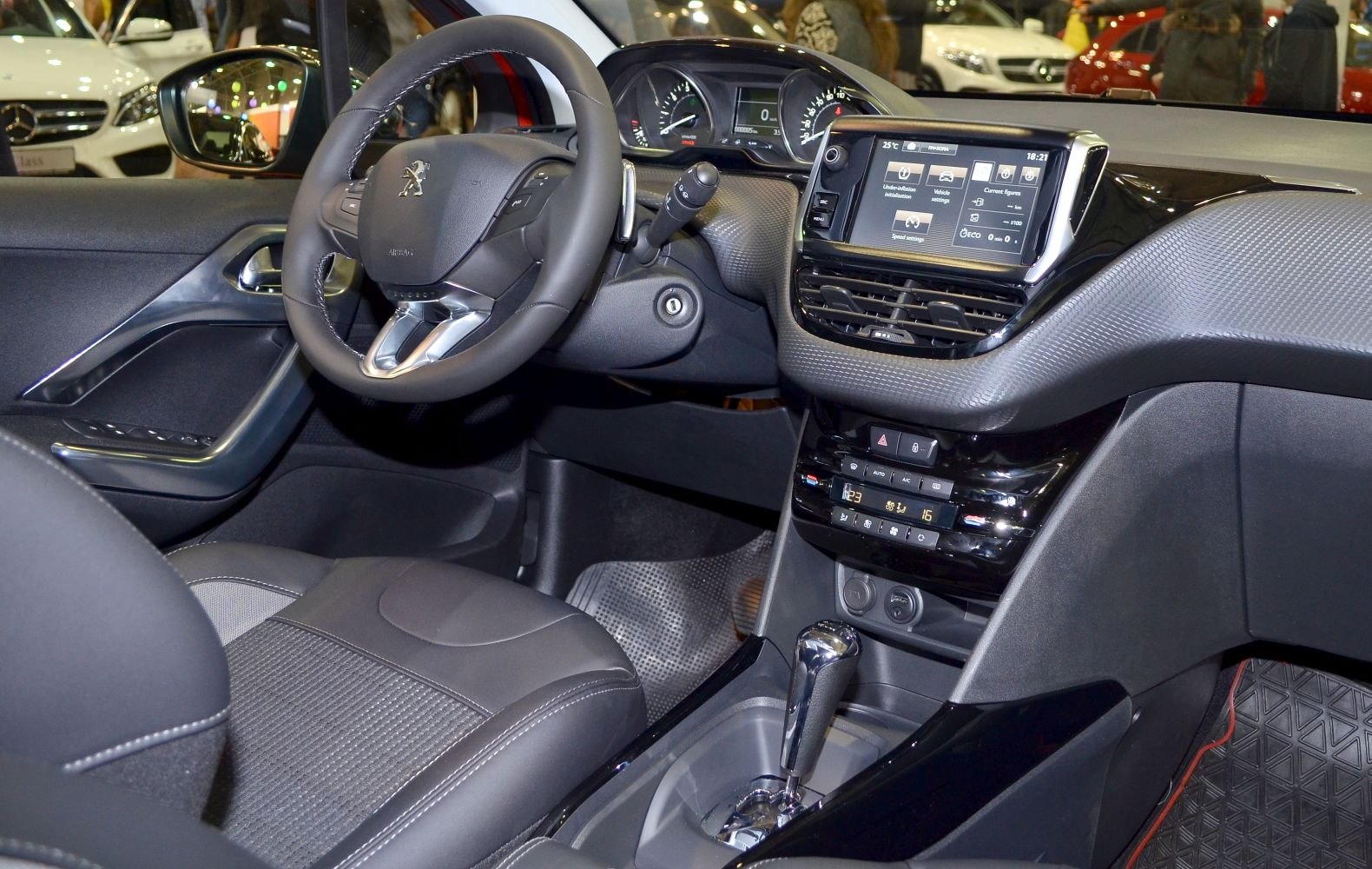 Dashboard with digital display and steering wheel with controls