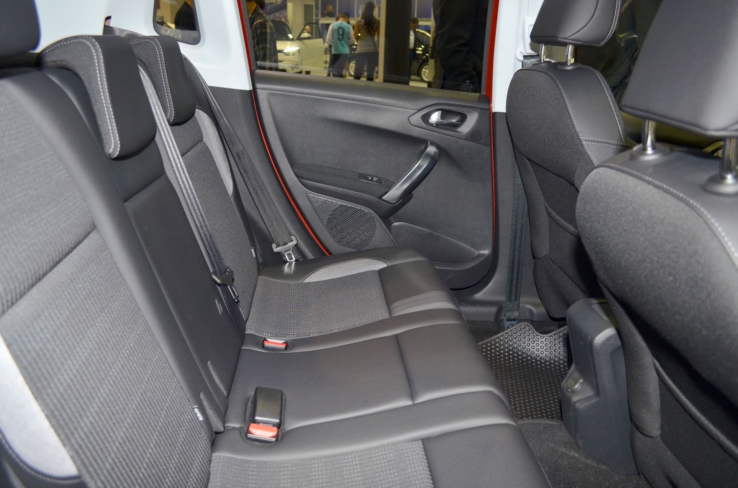Rear passenger seats with fabric upholstery and door panel details