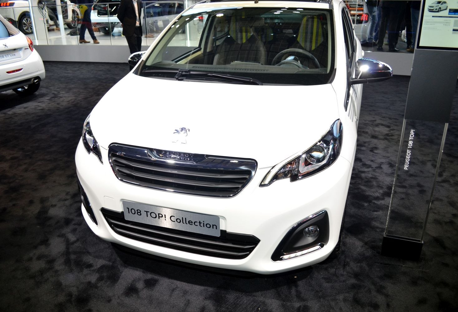 Front view of compact car with sleek grille and sharp headlights