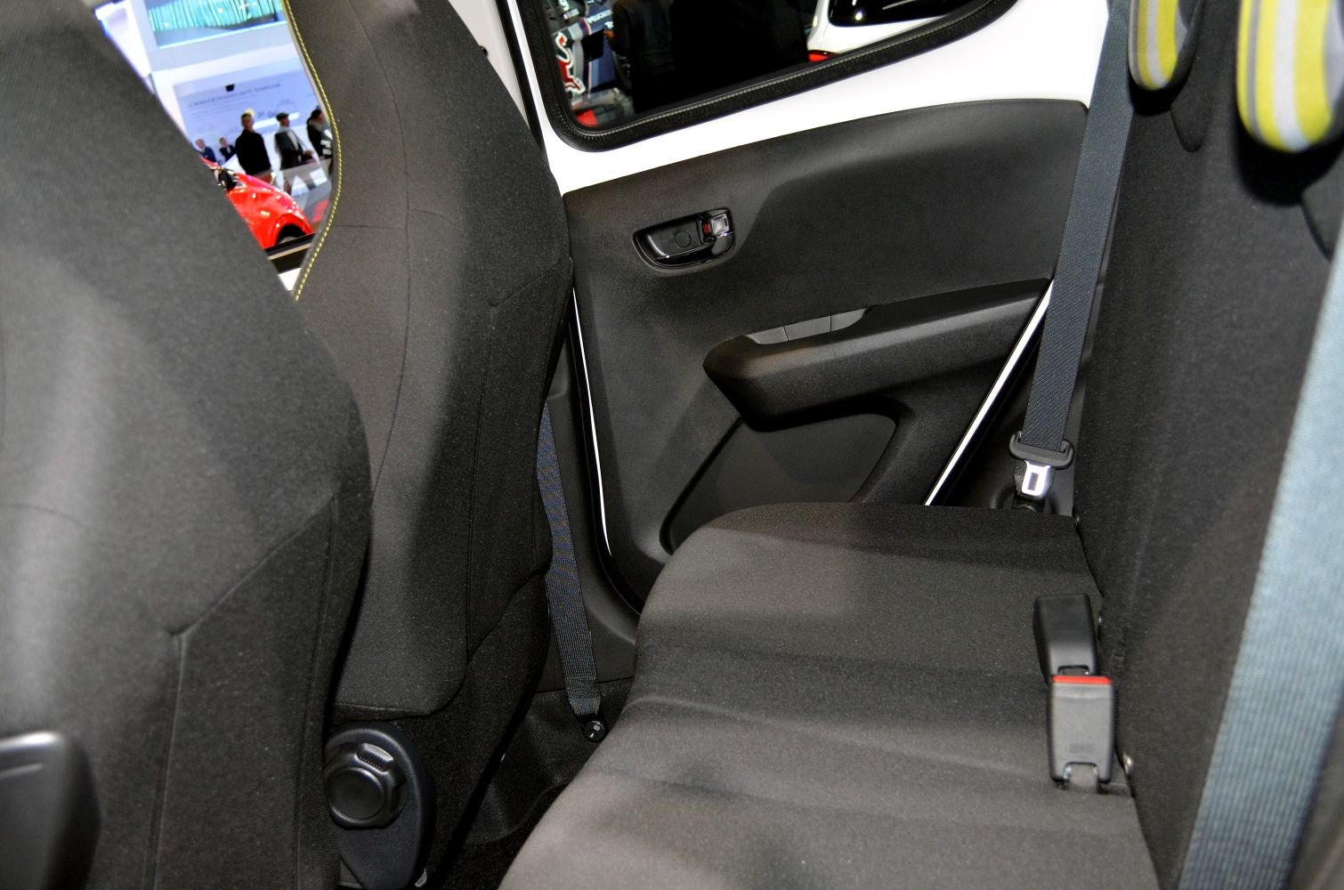 Rear passenger seat and door panel with seat belt and upholstery