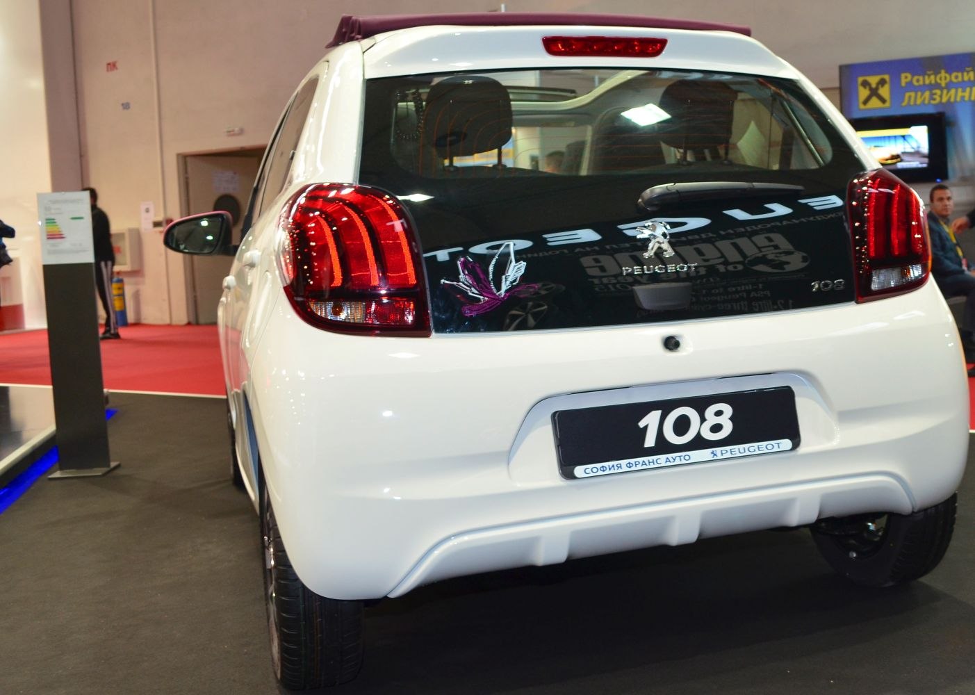 Rear view of compact hatchback with distinctive taillights and glass window