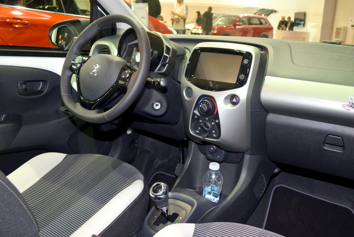 Car interior with dashboard and steering wheel