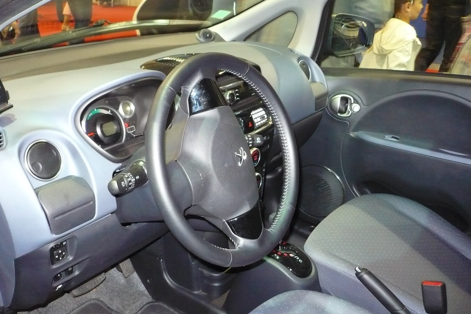 Dashboard and steering wheel with controls of compact electric car