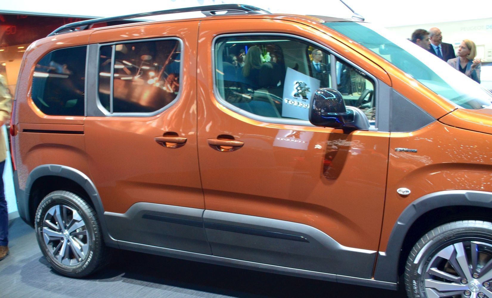 Side view of vehicle with sliding door and alloy wheels