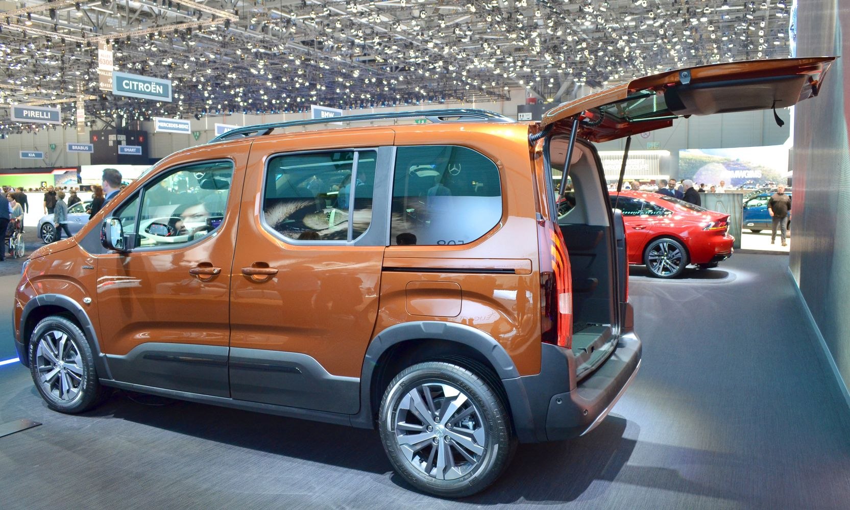 Open rear tailgate view of a modern multi-purpose vehicle