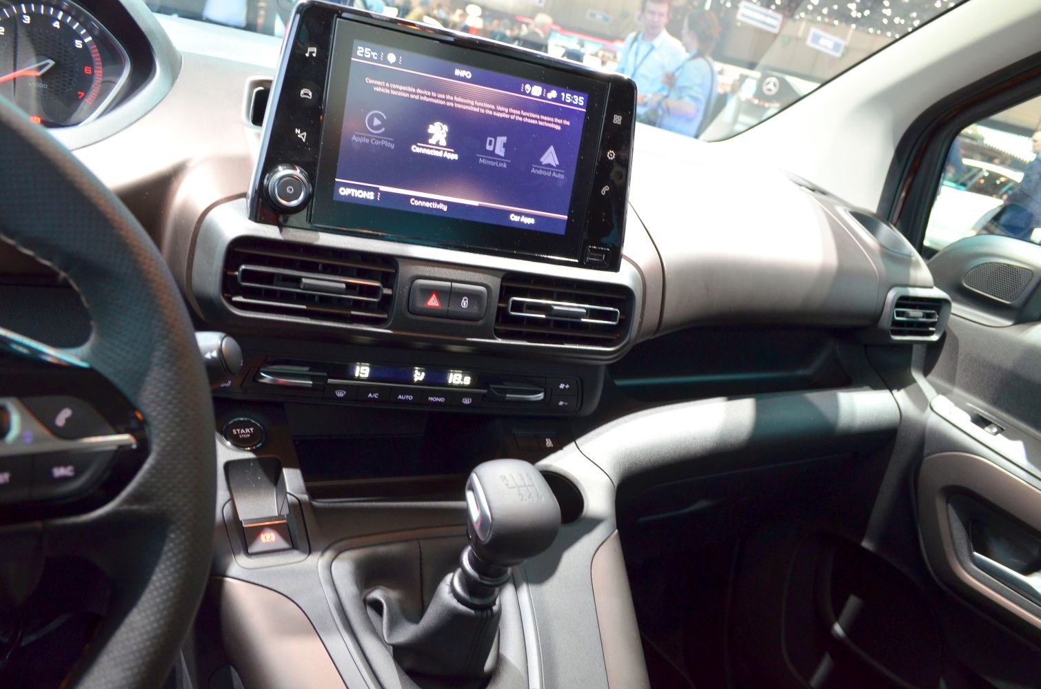 Infotainment display with manual gear shift and climate controls