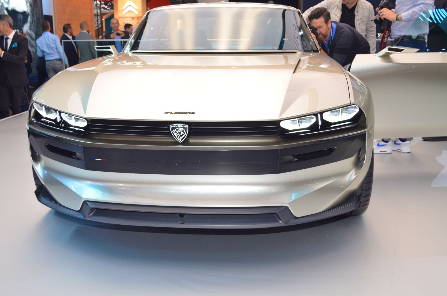 Front view with sleek headlights and bold grille design
