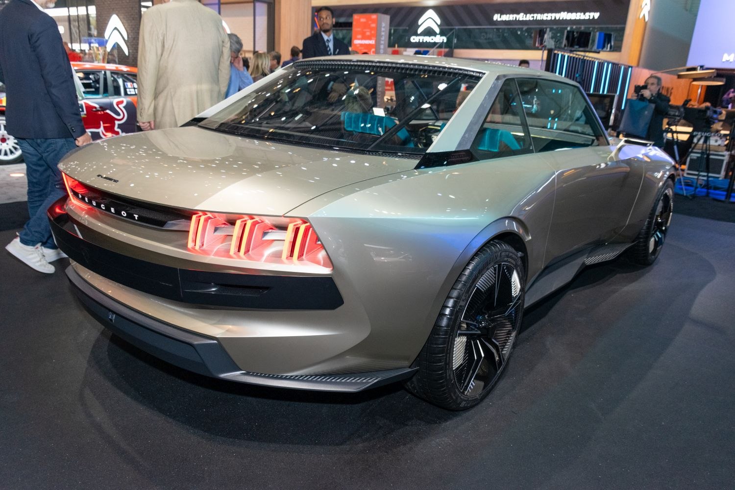 Rear LED taillights and aerodynamic side profile of a sleek concept car