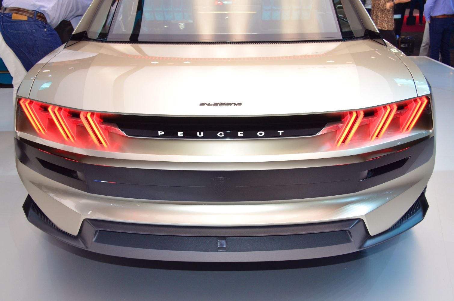 Rear view with triple claw LED taillights and black badge panel