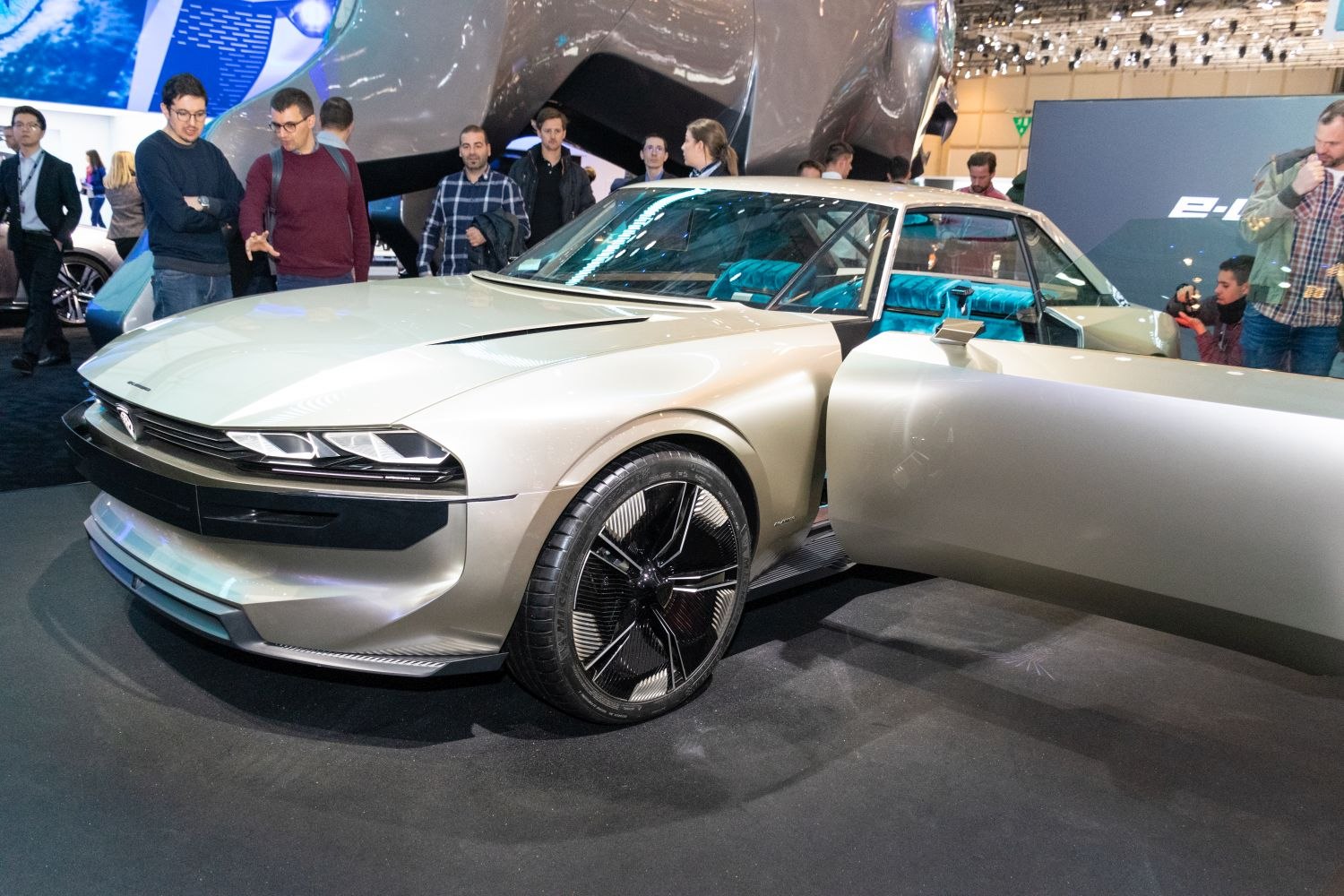 Sleek front design and open door with unique wheel style