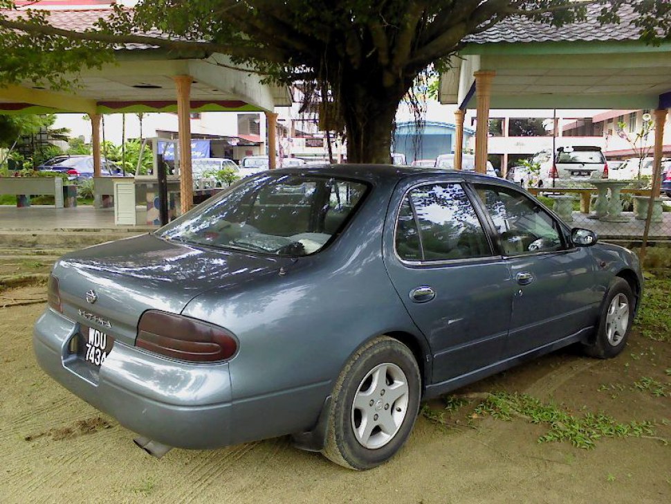 Rear side profile of sedan with alloy wheels