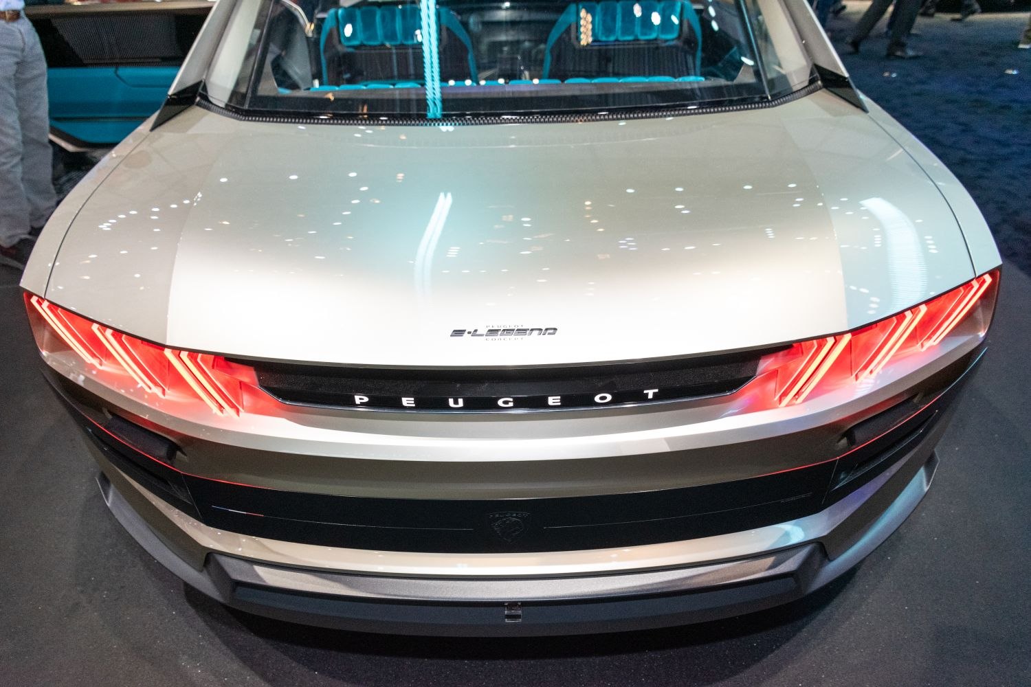 Sleek front with triple-stripe LED tail lights and prominent Peugeot branding