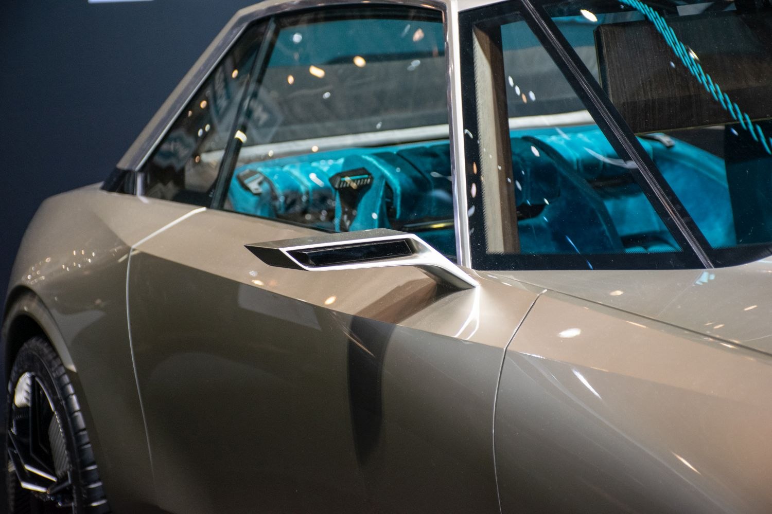 Side panel and futuristic wing mirror with visible interior dashboard
