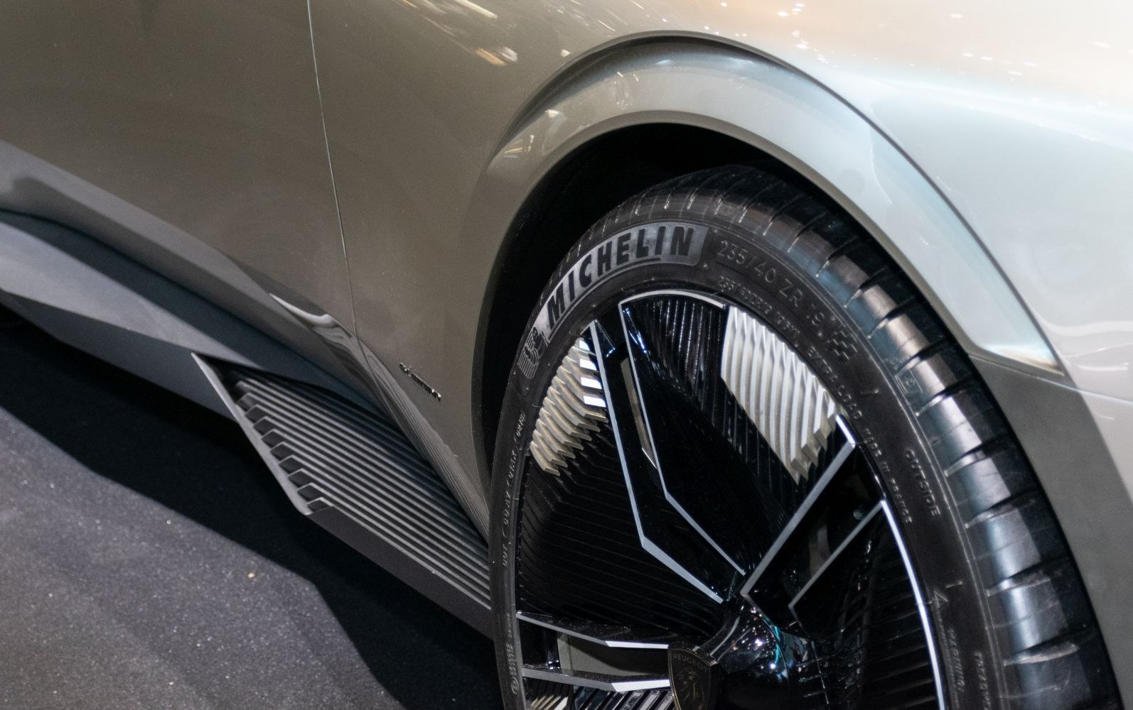 Close-up of rear wheel with Michelin tire and side skirt