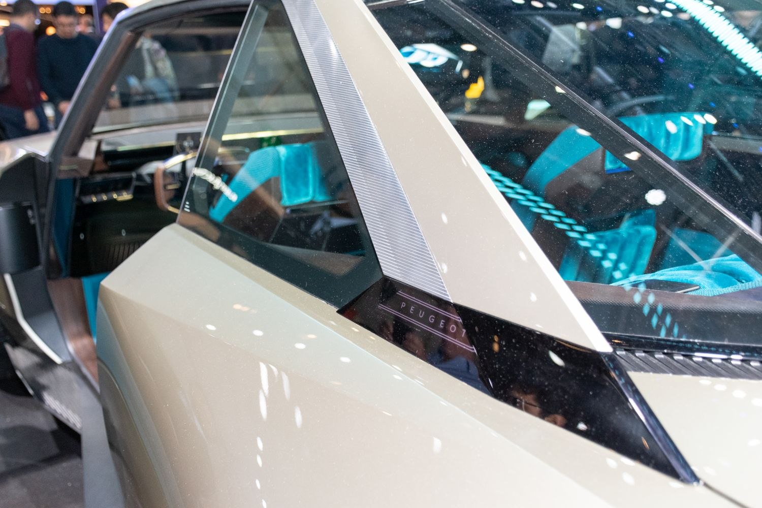Close-up of rear side window and blue interior upholstery