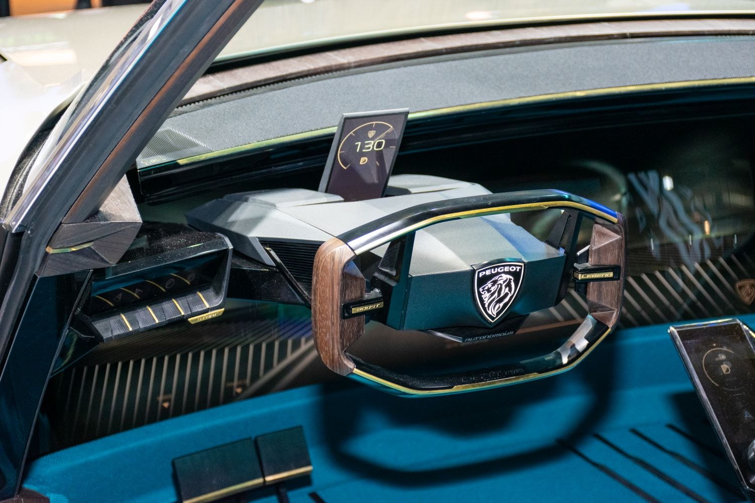 Futuristic steering wheel with wood accents and digital speed display