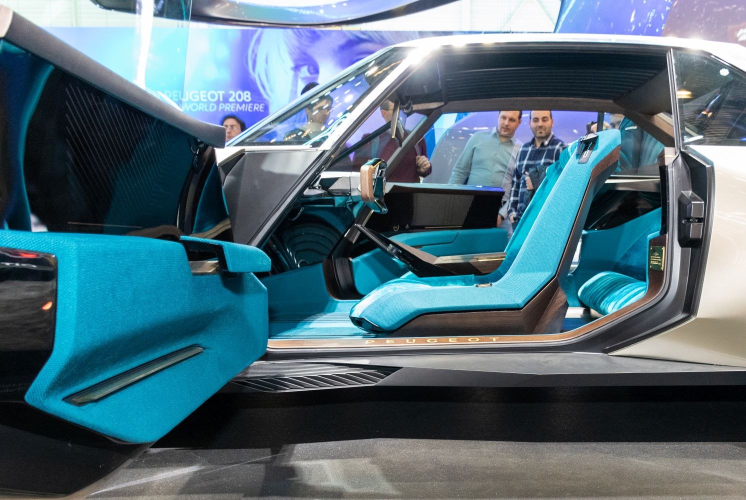 Futuristic turquoise car seats and avant-garde interior door design