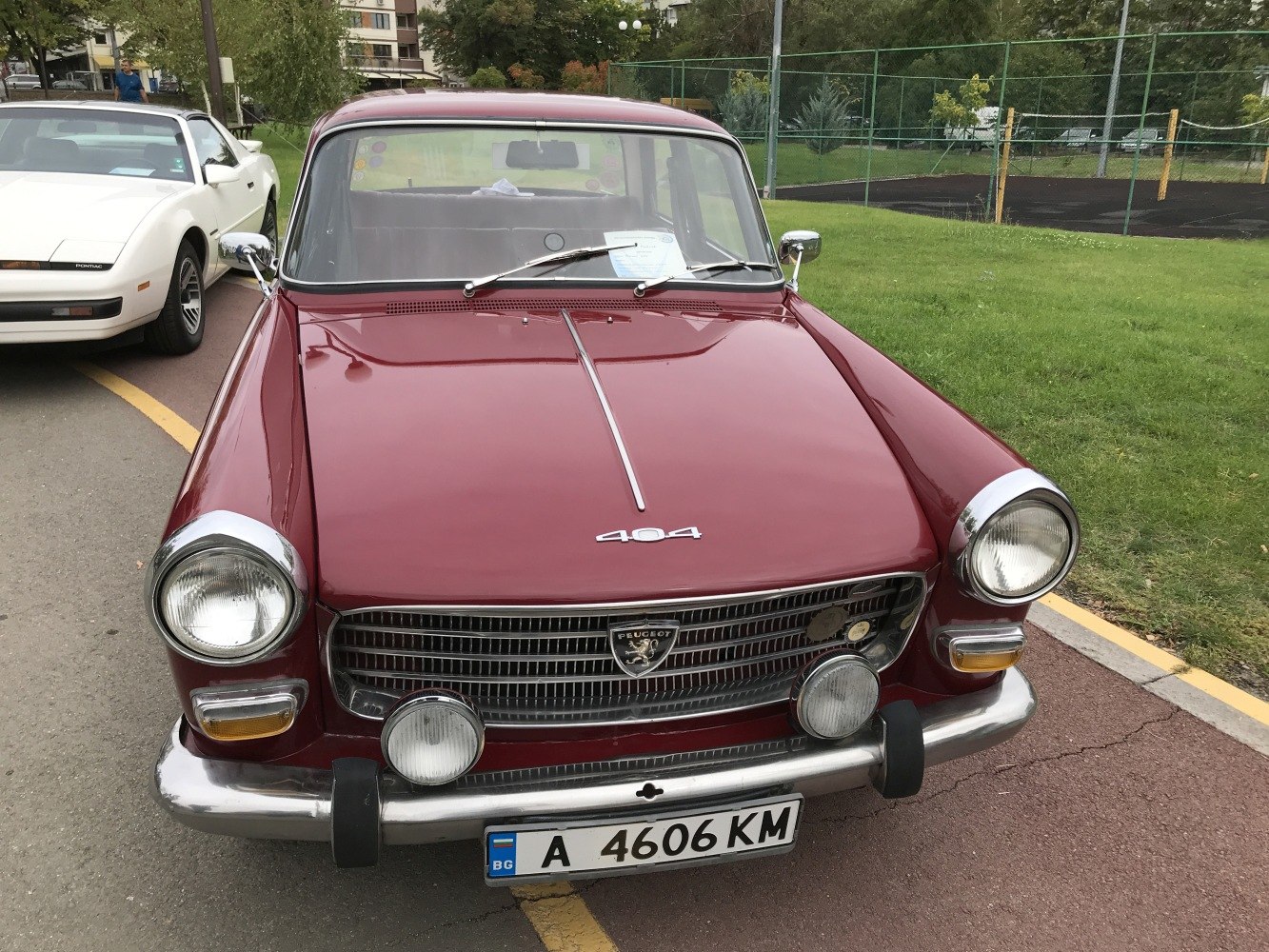 Front view of vintage sedan with round headlights and chrome bumper
