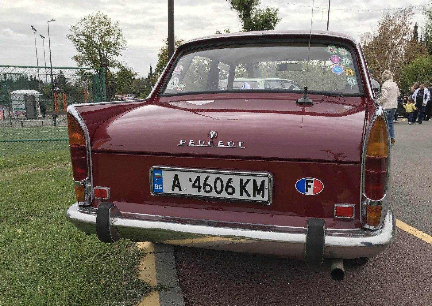 Rear view with tail lights and chrome bumper of classic sedan
