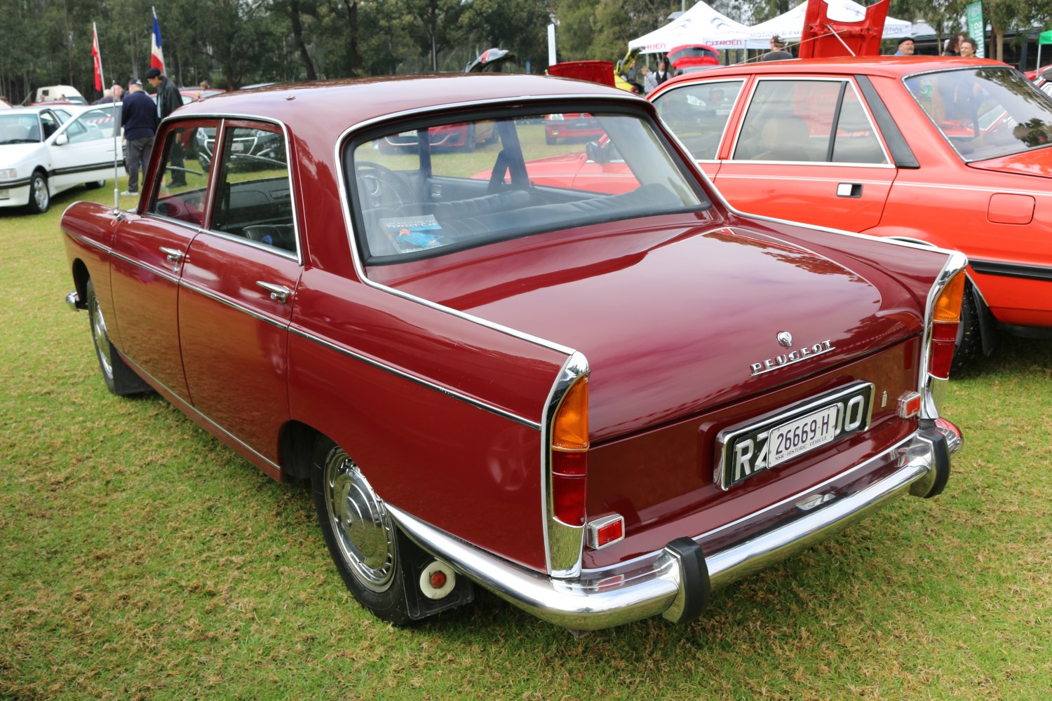 Boxy vintage sedan rear with chrome bumpers and classic tail lights