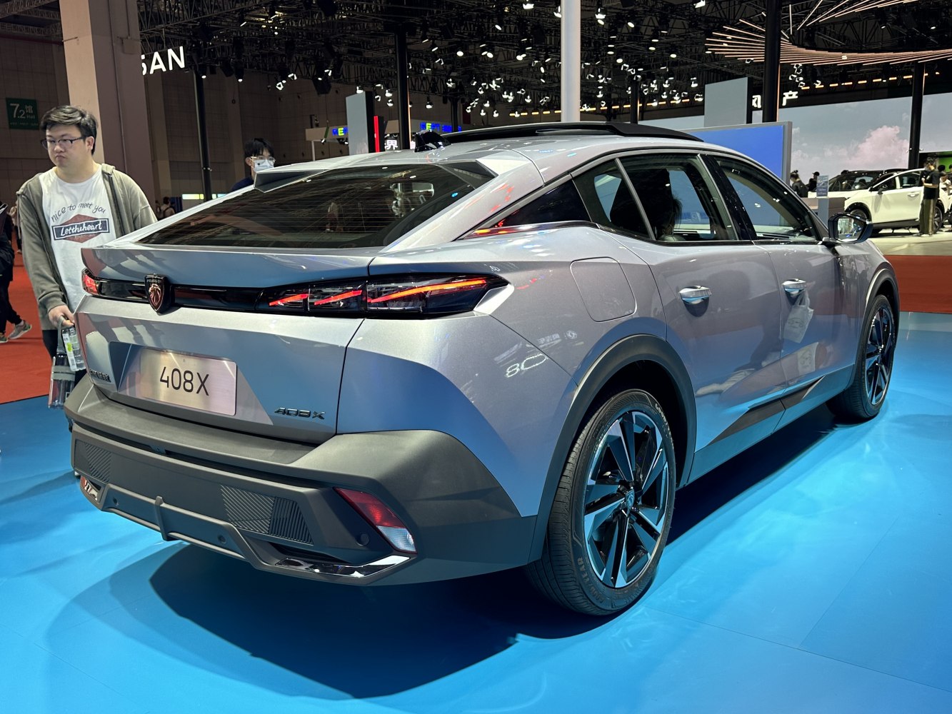 Rear view of a crossover with distinctive angular tail lights and a sloping roofline.