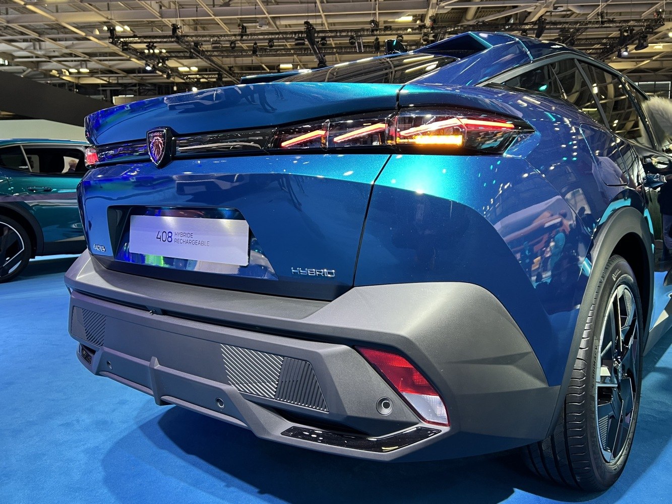 Rear hybrid badge, modern tail light design, and rear bumper details on crossover SUV