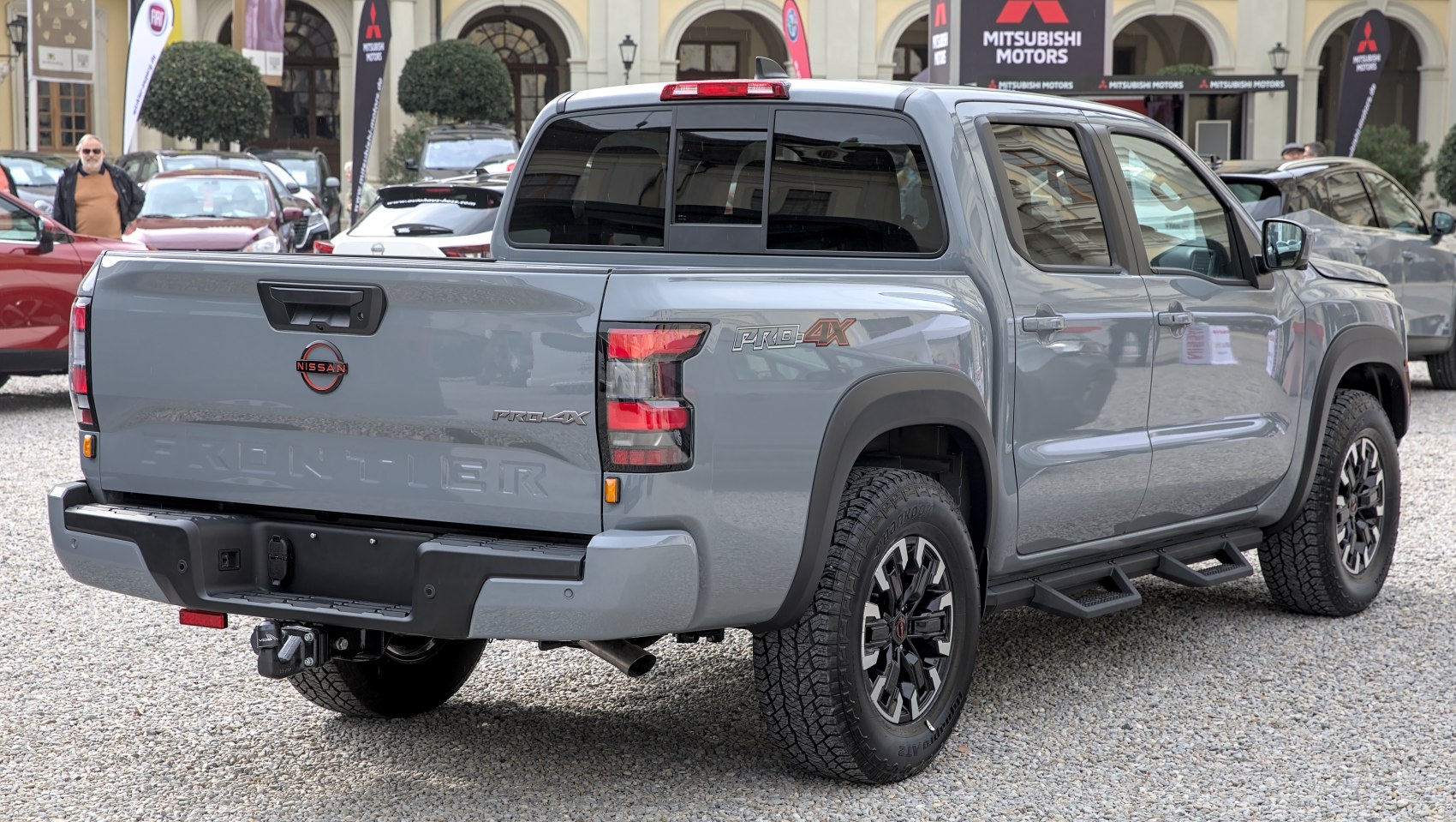Rear and side view of pickup with PRO-4X badging and step bars