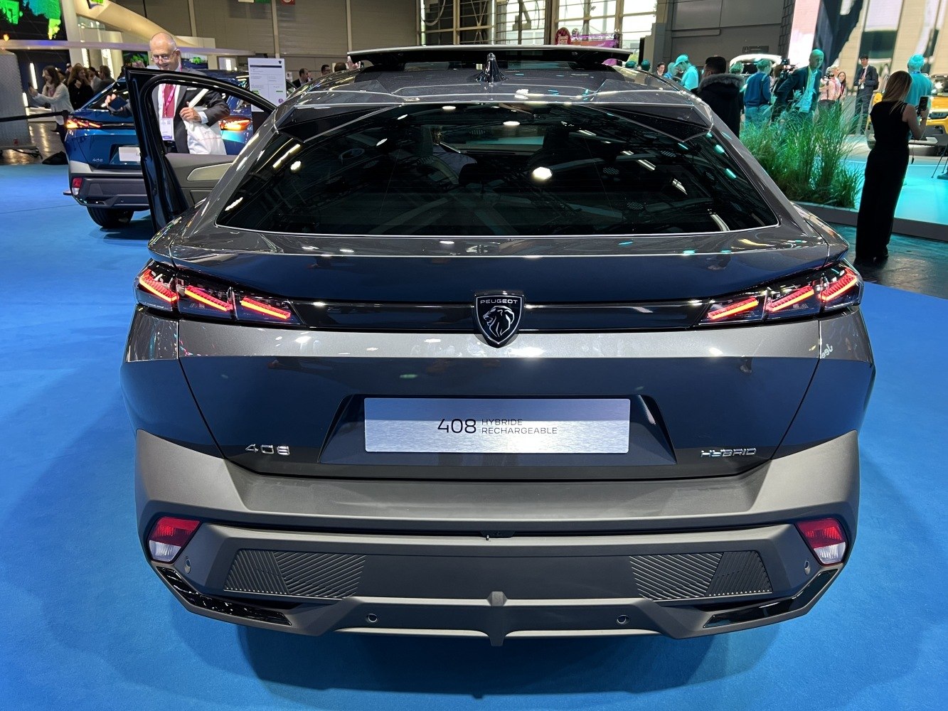 Rear view of a crossover with hybrid badge and modern styled taillights