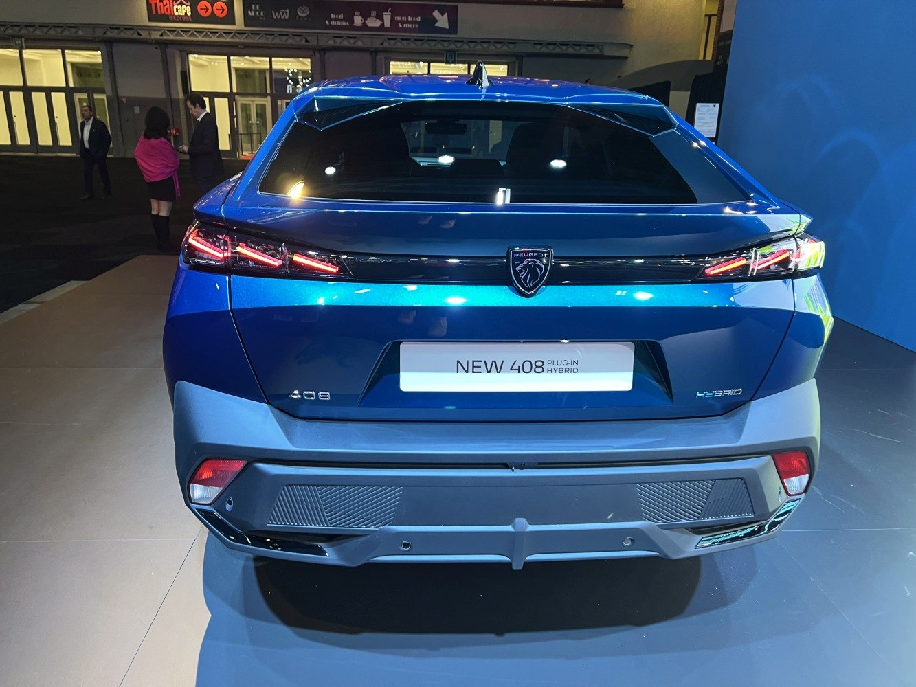 Sleek rear view with modern tail lights and hybrid badge