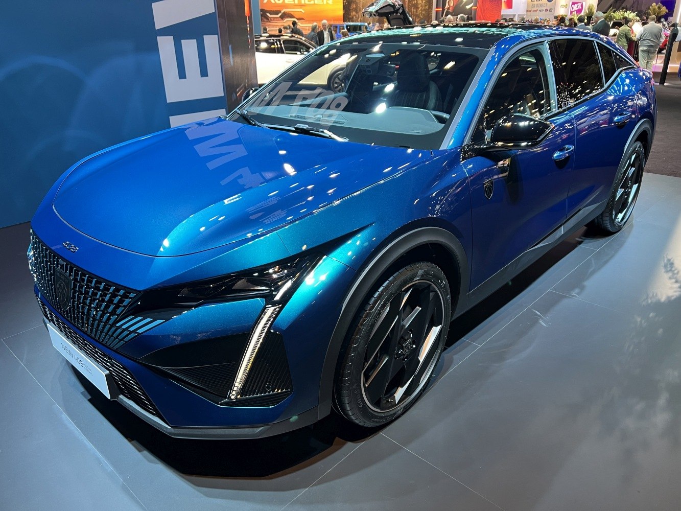 Front and side view of crossover with sharp LED headlights and aerodynamic body
