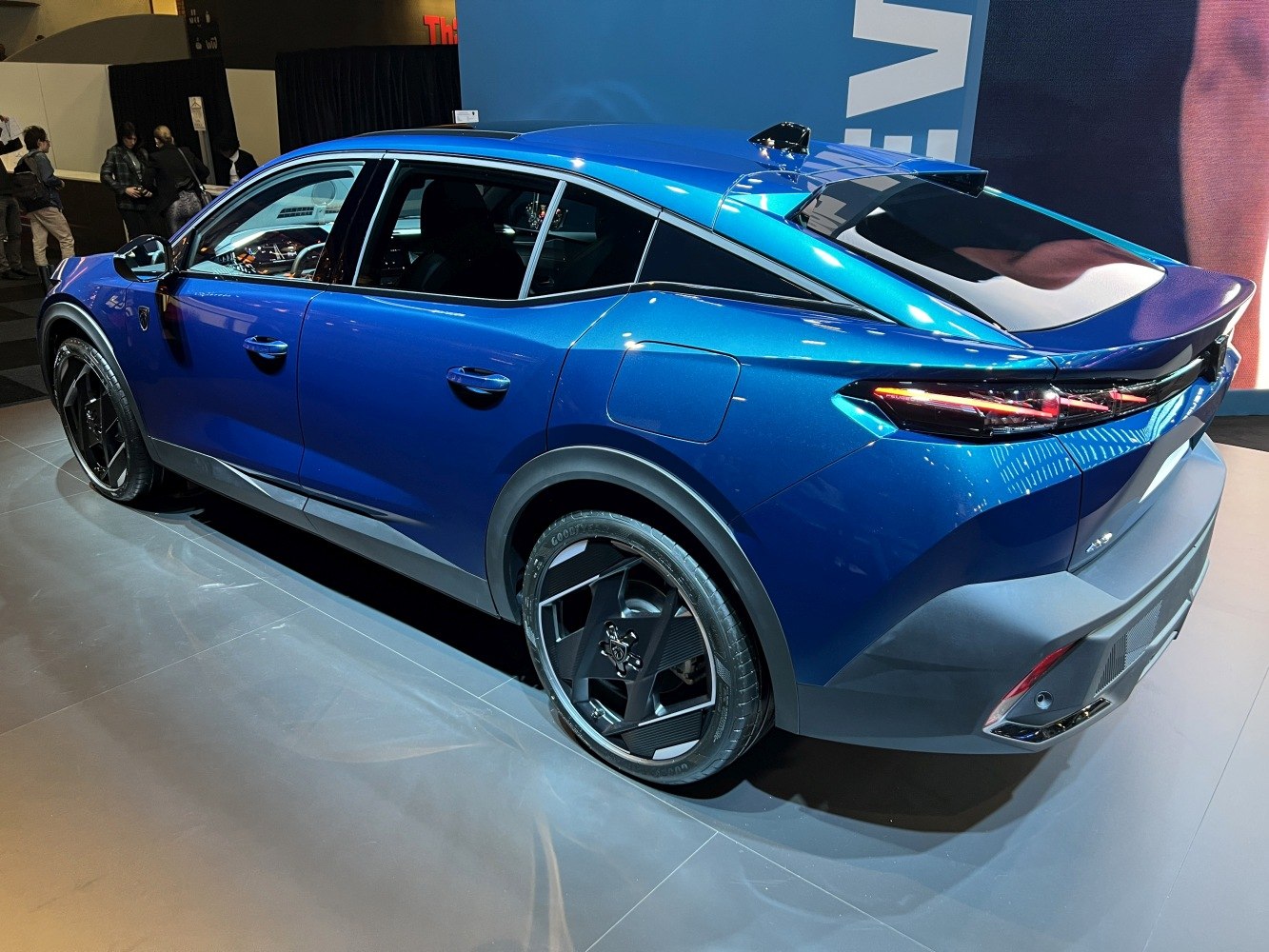 Rear side view of crossover with alloy wheels and sleek taillights
