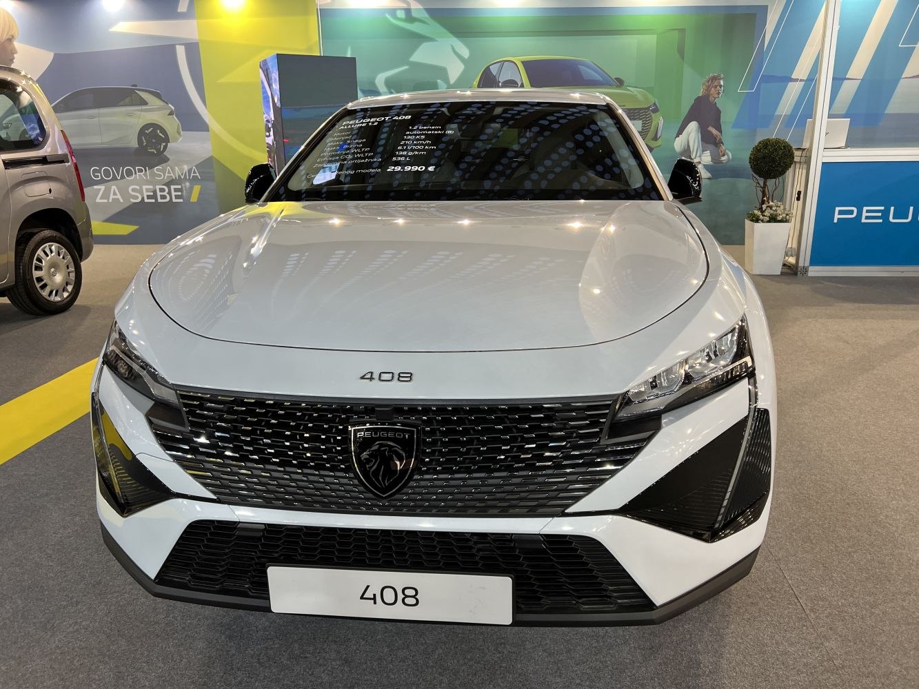 Front view of a modern crossover with distinctive grille and sharp headlights