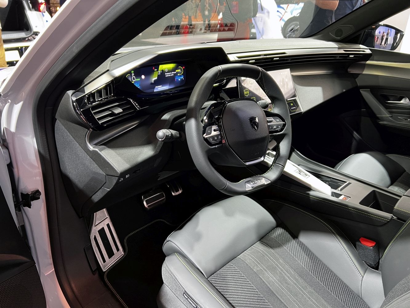 Modern digital dashboard and ergonomic steering wheel with luxury seats