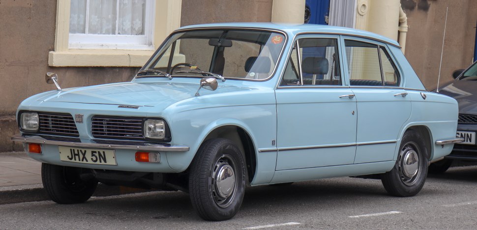 Light blue vintage sedan with rectangular headlights and chrome side mirrors