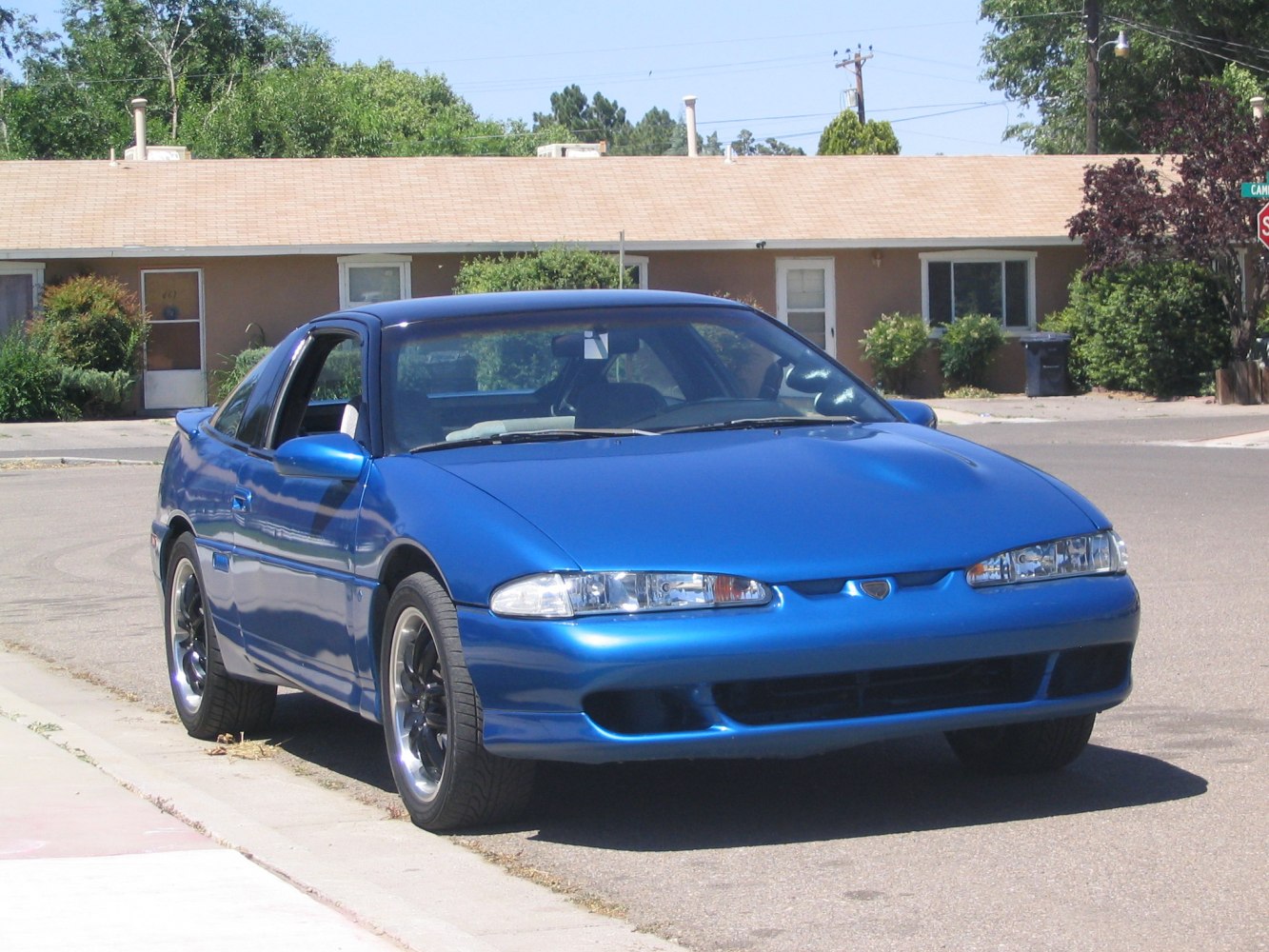 Front view with sleek headlights and black sporty alloy wheels