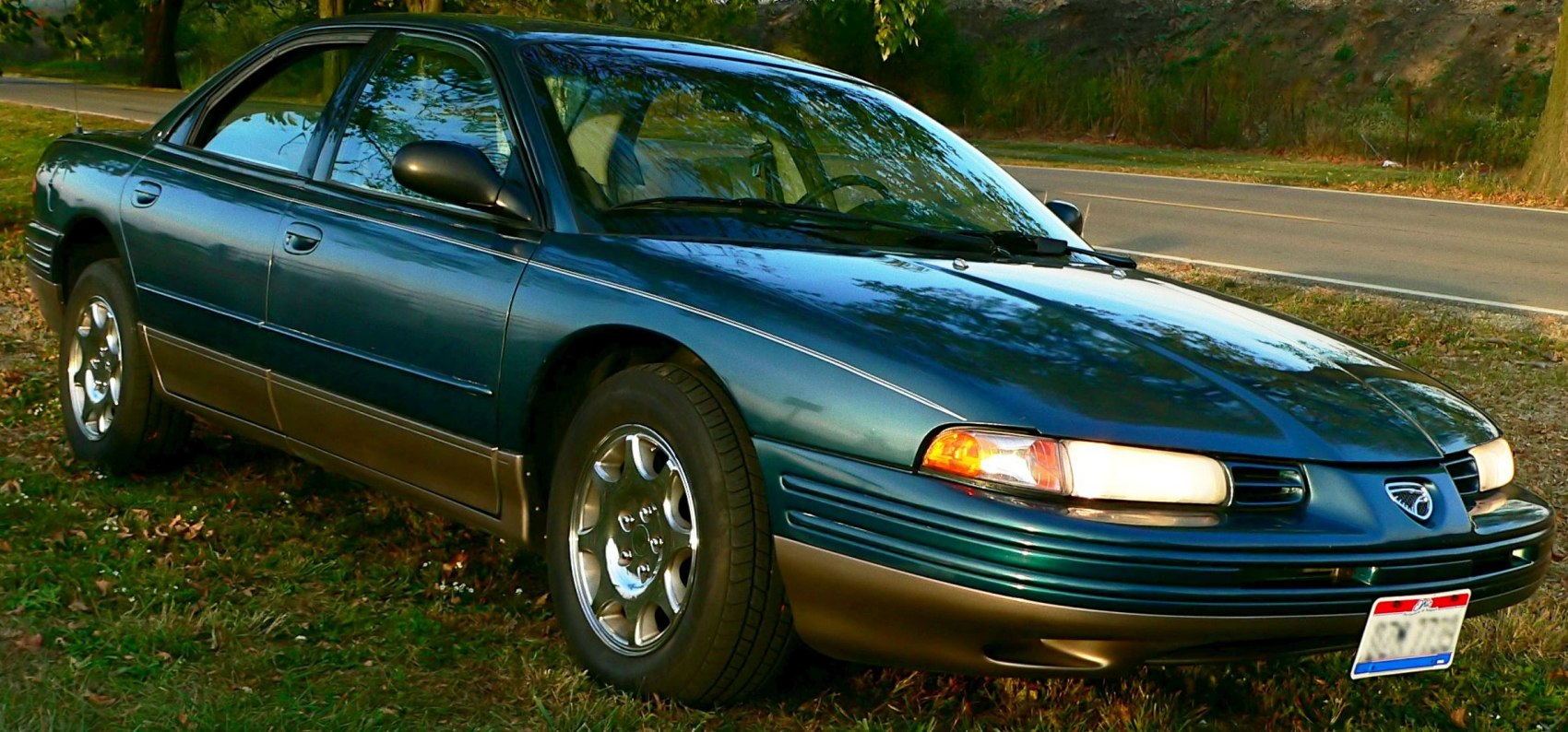 Front-side view with classic headlights and alloy wheels