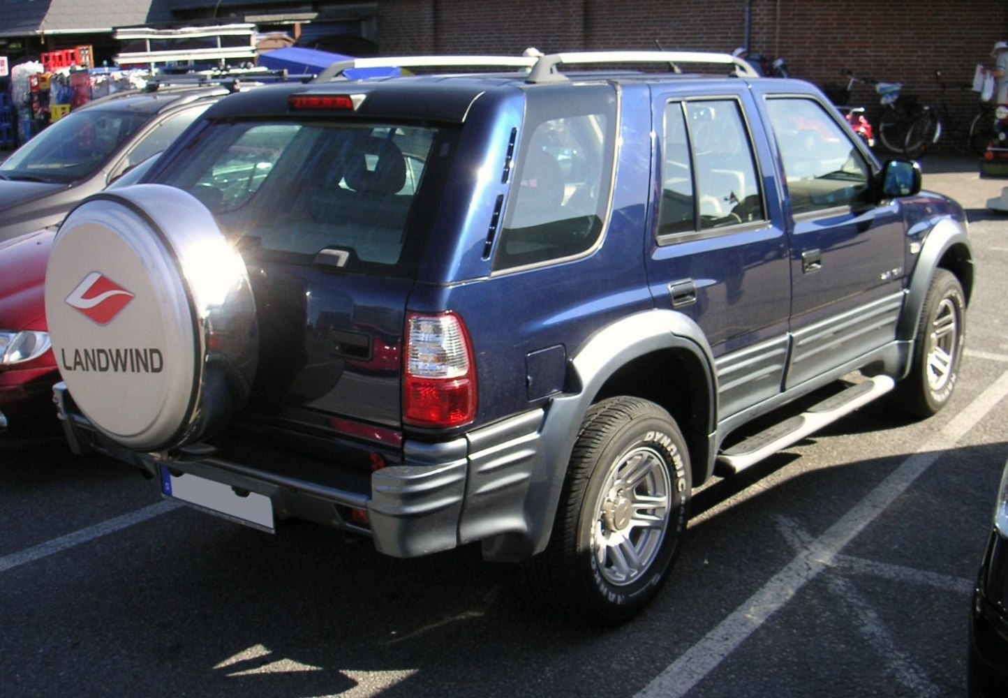Rear view with spare tire cover and side steps