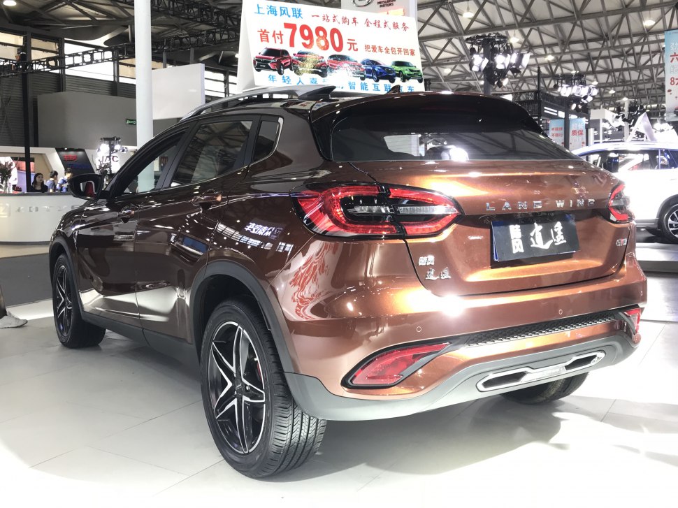 Rear view of SUV with distinctive tail lights and alloy wheels.