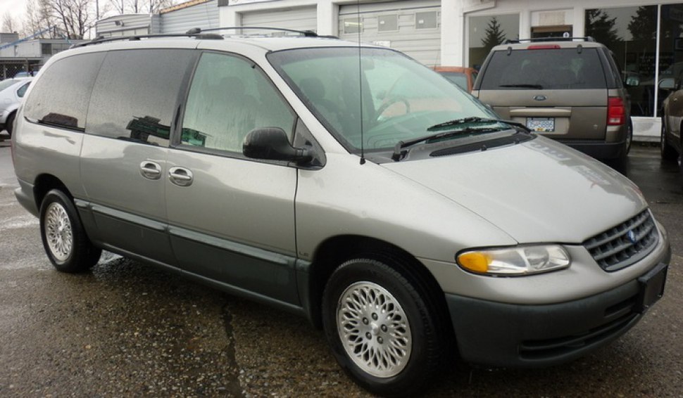 Side view of vintage minivan with sliding doors and alloy wheels