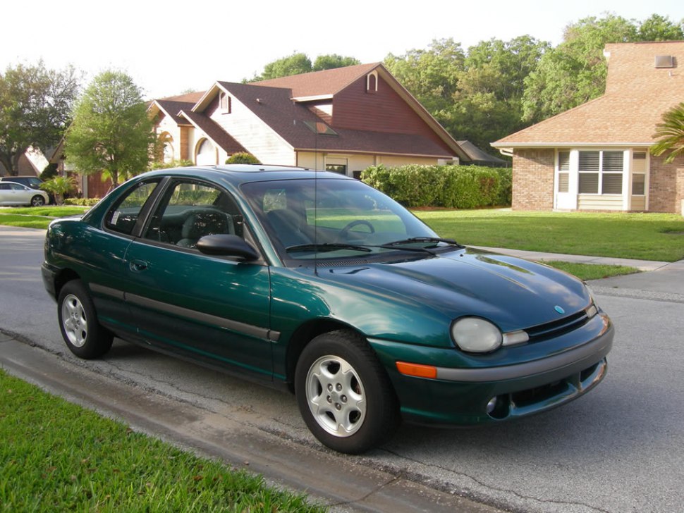 Compact green coupe with rounded headlights and two doors