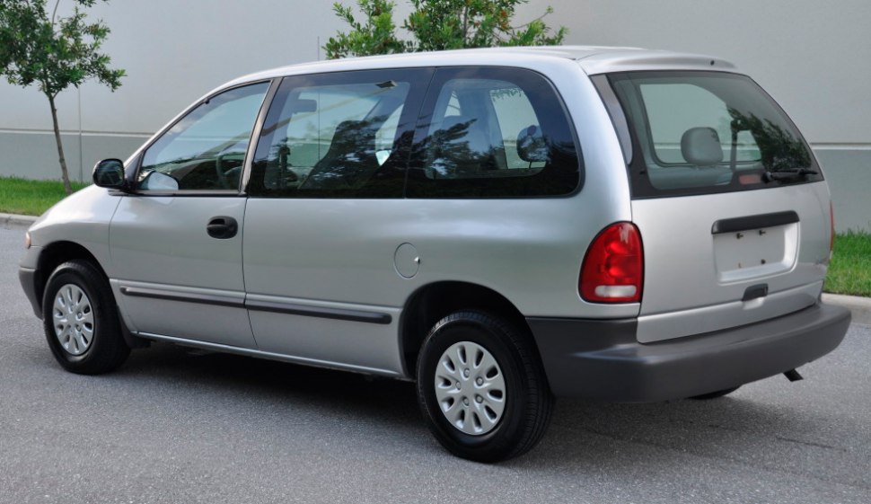 Silver minivan with rear side profile and sliding door