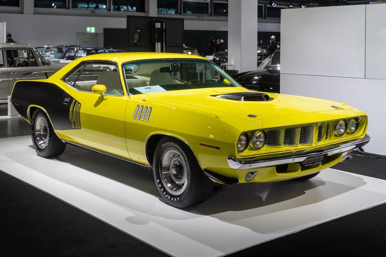 Bright yellow muscle car with prominent 440 hood scoop and black side graphics.