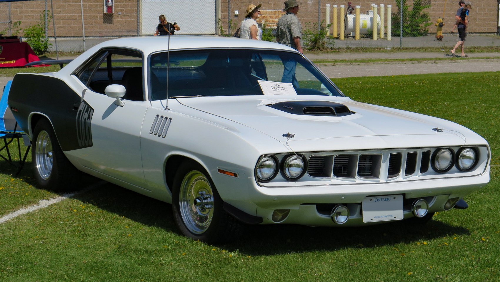 Hood scoop and rear quarter panel racing decal on classic muscle car