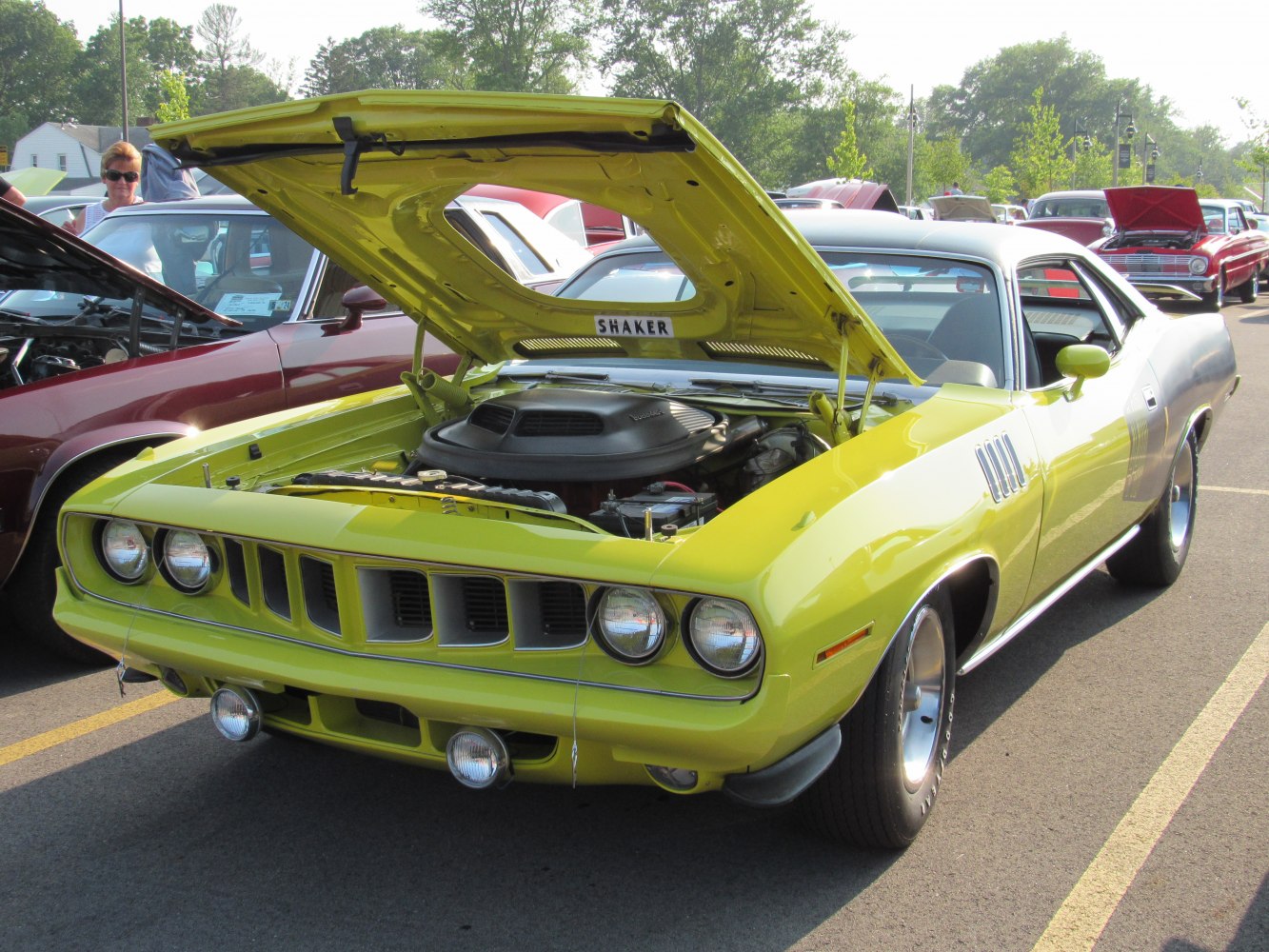 Front view of muscle car with shaker hood scoop and open engine bay