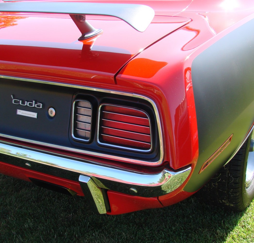 Rear taillight, spoiler and chrome bumper close-up