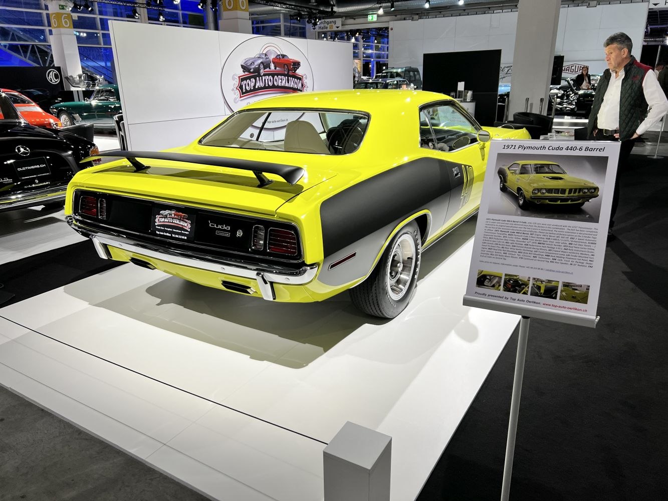 Vibrant yellow rear view with black spoiler and stripes