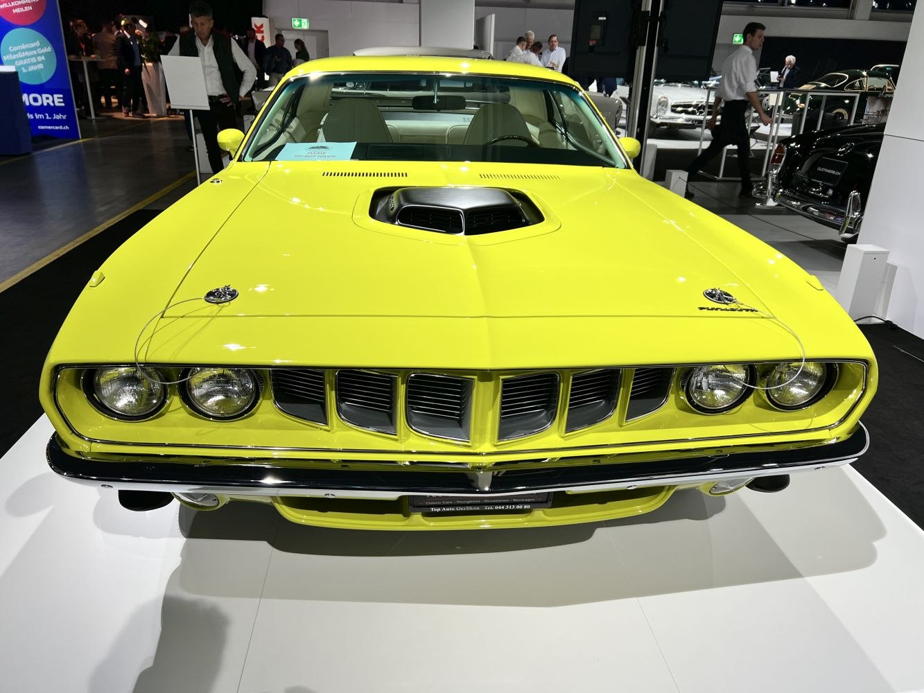 Front end view with distinctive hood scoop and aggressive grille